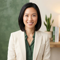 Dr. Sarah Chen, a nutrition expert, smiling in a professional headshot against a clean, light-toned background.
